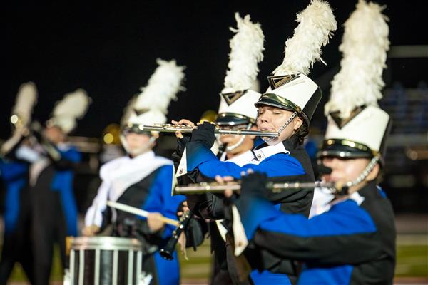 Brentwood High band members play on the football field